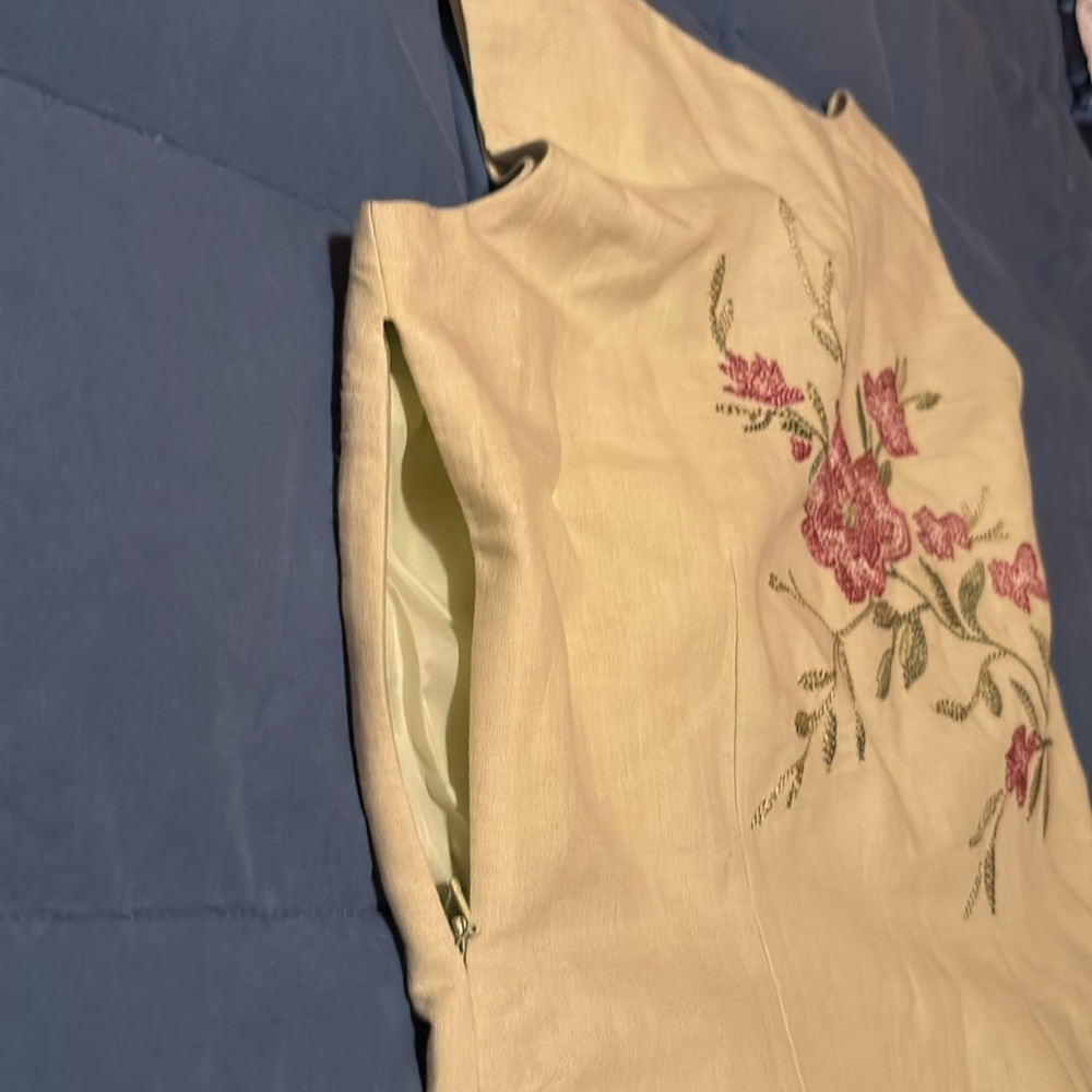 Beautiful linen/cotton sheath with embroidering front and back. Summer “dressy”.
